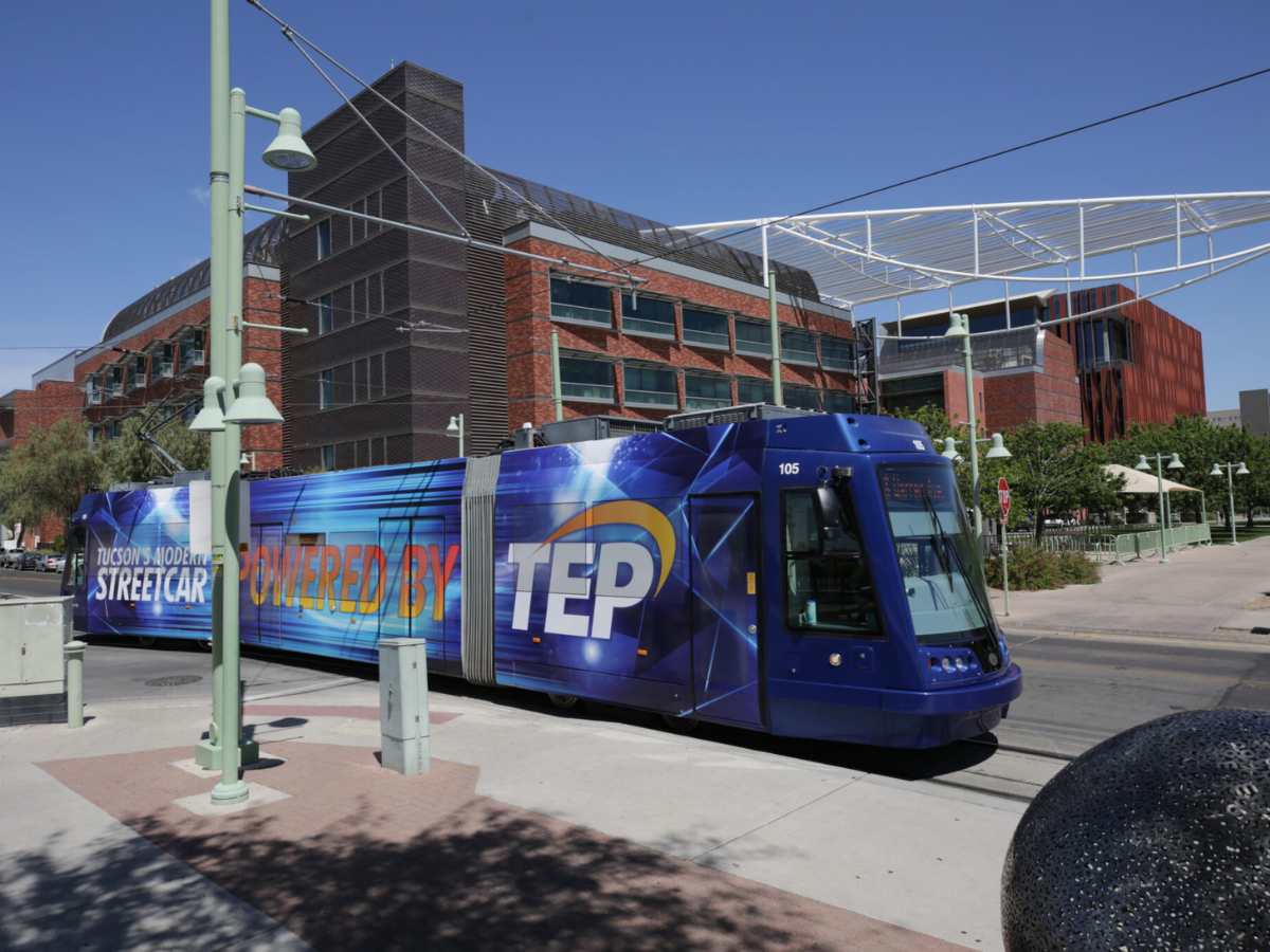 Sun Link blue Streetcar with Tucson's modern streetcar and powered by TEP on side for article Getting Around Town in Tucson for newcomers moving to Tucson.