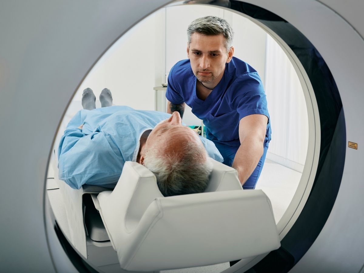 Tech loading a patient into an MRI machine for article City of Tucson Health Services for newcomers moving to Tucson.