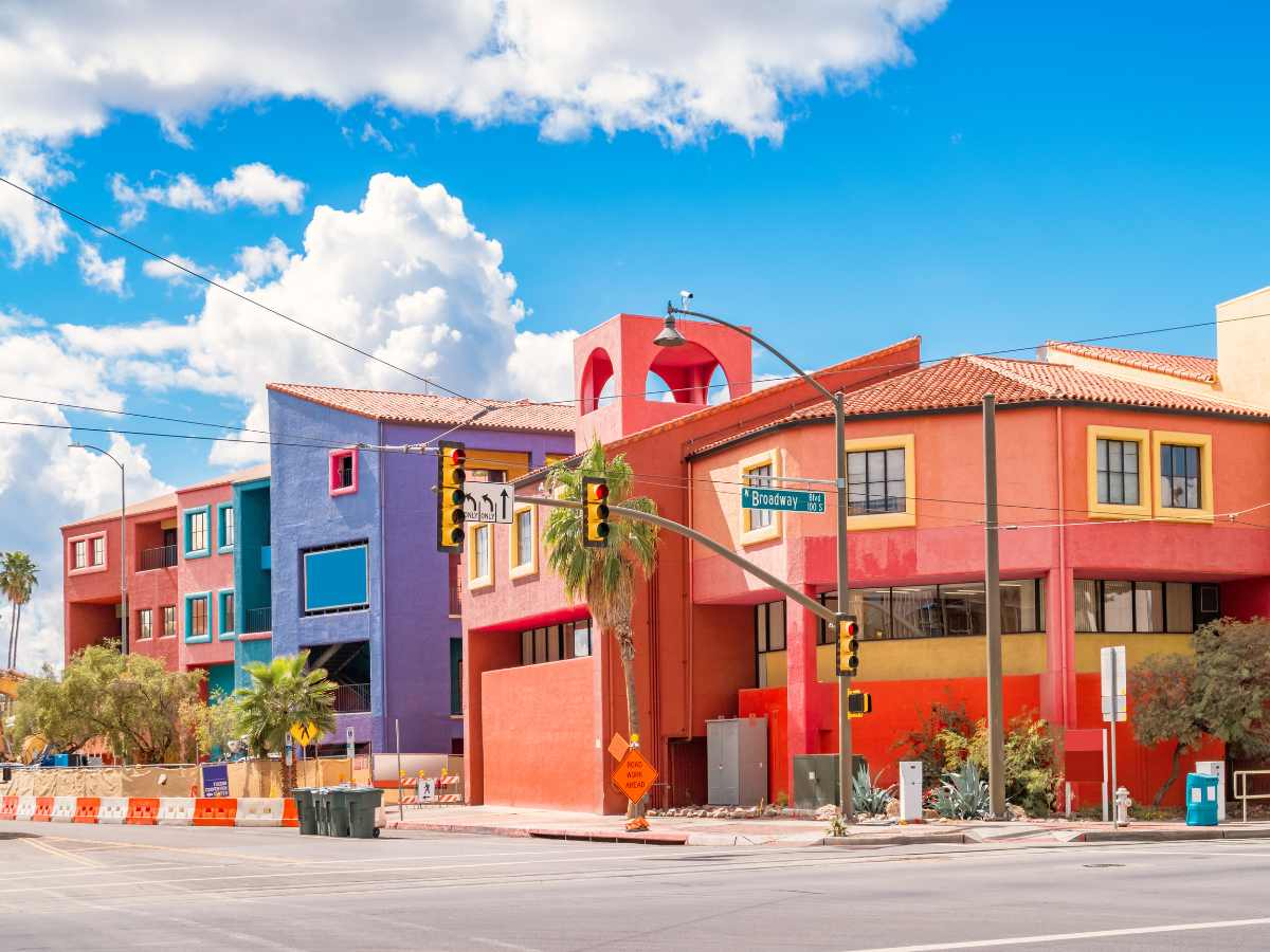 Colorful orange, salmon, turqoise, yellow, blue and purple housing in downtown Tucson for article Tucson Housing Market in 2025 for newcomers moving to Tucson.