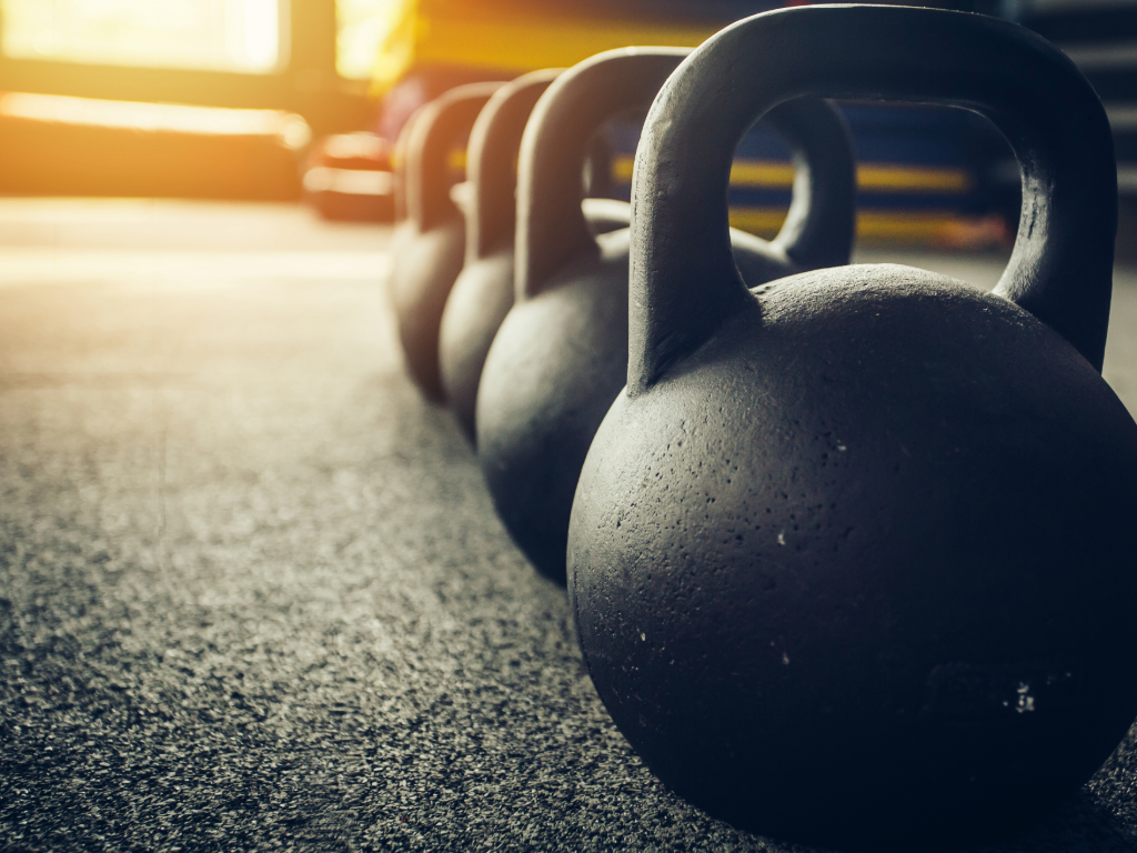 Close up of kettlebells at a gym.