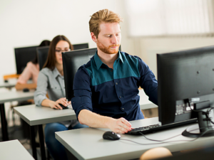 People sitting in a computer training class.