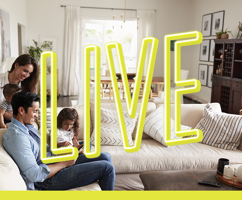 Department graphic: Family looking at computer on couch