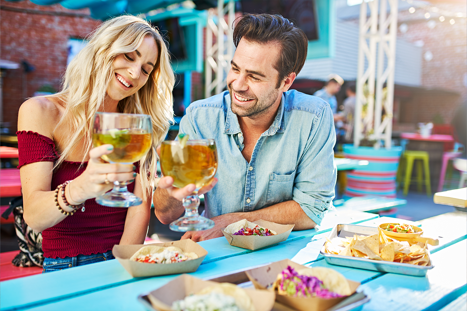 Department graphic: Couple enjoying a meal outside